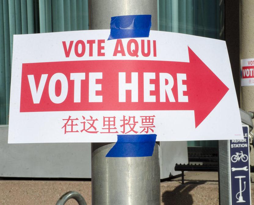 Voting+signs+in+Spanish%2C+English%2C+and+Chinese+show+the+way+to+the+polling+station.+Photo+by+Tim+Brown.++From+U.S.+State+Department.