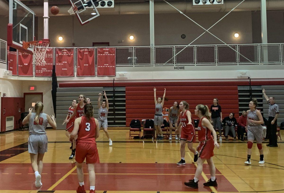 Freshman Maci Durkin puts up a three-point shot in the fourth quarter. Photo by author.