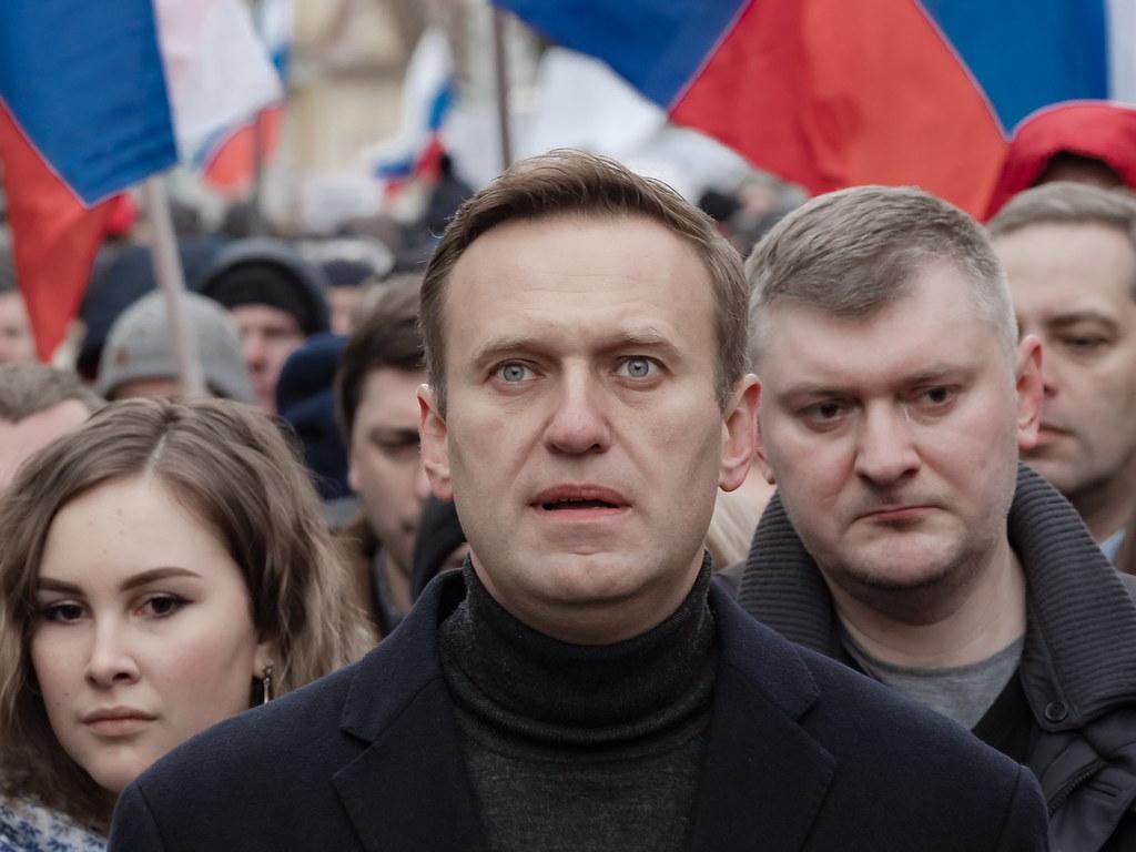 Alexei Navalny looks to the sky during a march in memory of Boris Nemtsov, a Putin-opposition politican who was killed in Russia