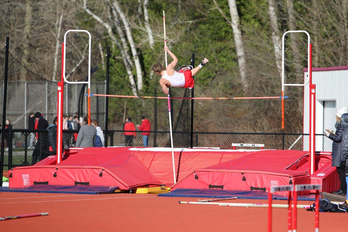 Ryan Collins 21 soars over the pole vault crossbar. Photo by Jen Smith.