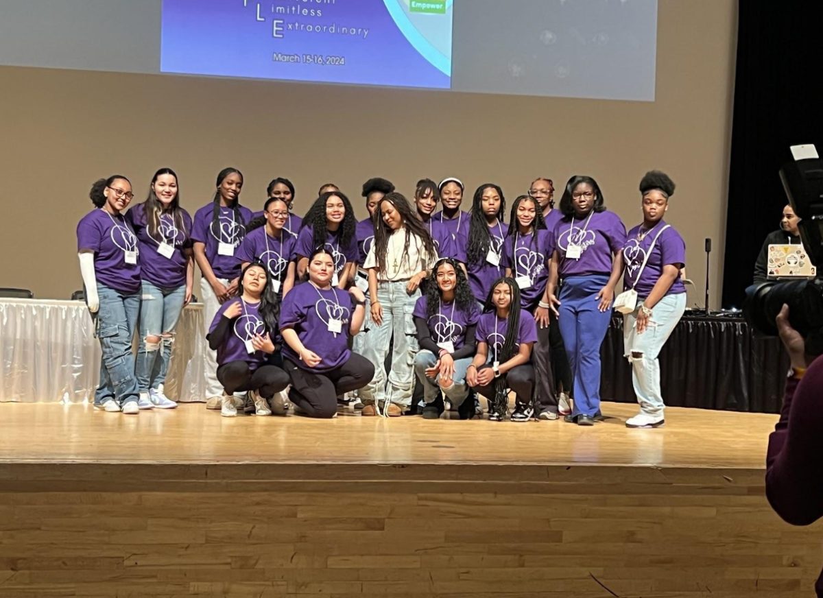 Photo shows students posing after a club meeting