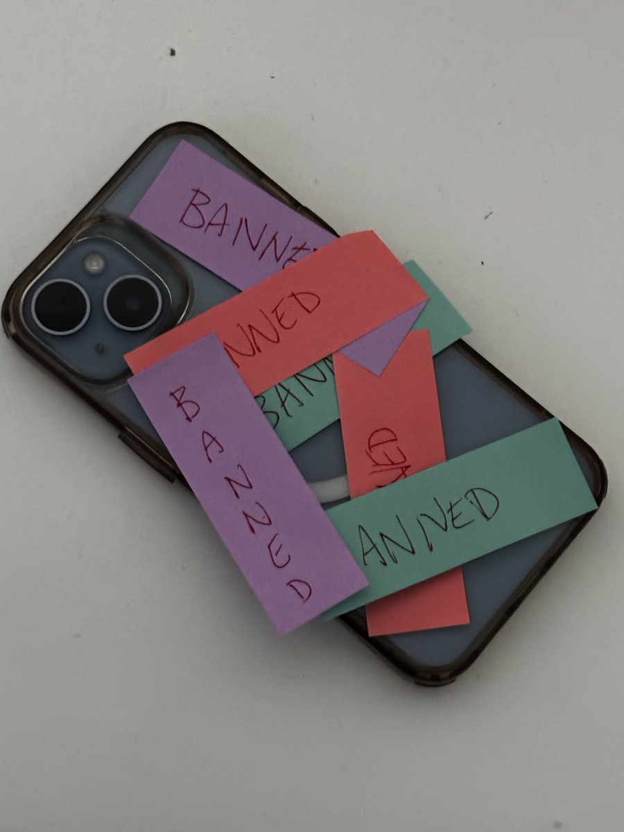 Picture shows phone with banned stickers covering it. Photo courtesy of Nicole Chen, '26