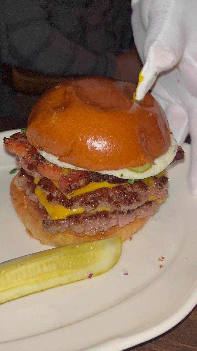 10 ounce double wagyu cheeseburger with thick-cut bacon and a runny egg from 4 Charles
