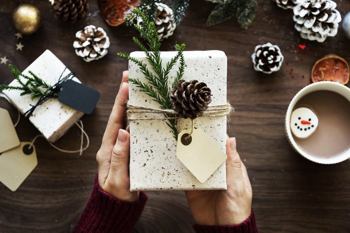 Photo shows a present over a table. Photo courtesy of rawpixel on Pixabay